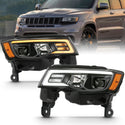 ANZO 2017-2018 Jeep Grand Cherokee Projector Headlights w/ Plank Style Switchback - Black w/ Amber